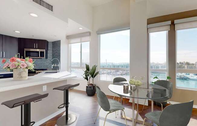 A modern kitchen with a bar area and a dining table set up at Esprit Marina del Rey, 90292