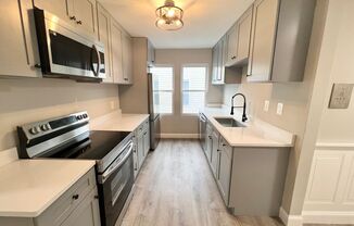 NEWLY RENOVATED PENTHOUSE UNIT WITH PARKING AND STORAGE!