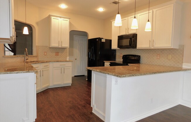 Two Primary Suites in the 4-bedroom 3.5-bathroom home in Enciro Forest