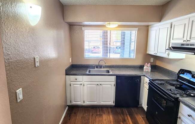 2x2 Downstairs Brown Upgrade Kitchen at Mission Palms Apartment Homes in Tucson AZ