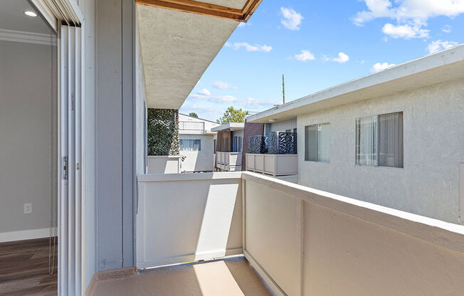 Private balcony with view into communal courtyard.