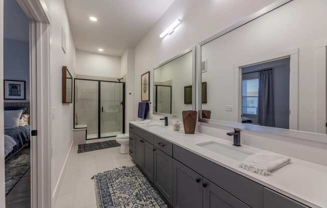 Apartments in Downtown Dallas for Rent- 4600 Ross- Kitchen with Stainless-Steel Appliances and Modern White & Grey Cabinets