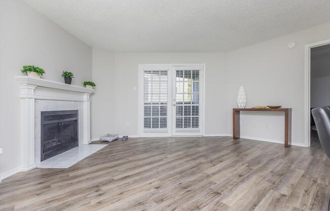 a living room filled with furniture and a large window