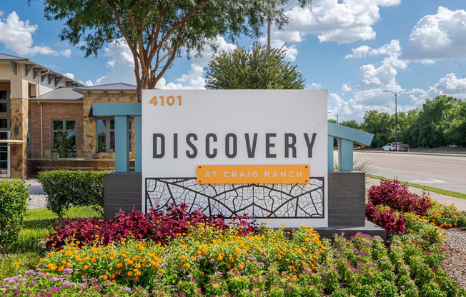 a sign for the discovery at crab ranch in front of a building