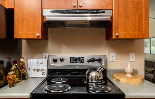 a kitchen with a stove top oven next to a counter