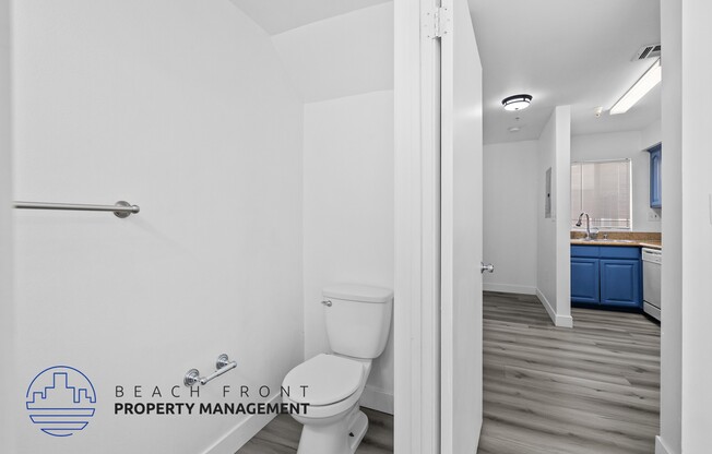 a bathroom with a toilet and a sink in a house