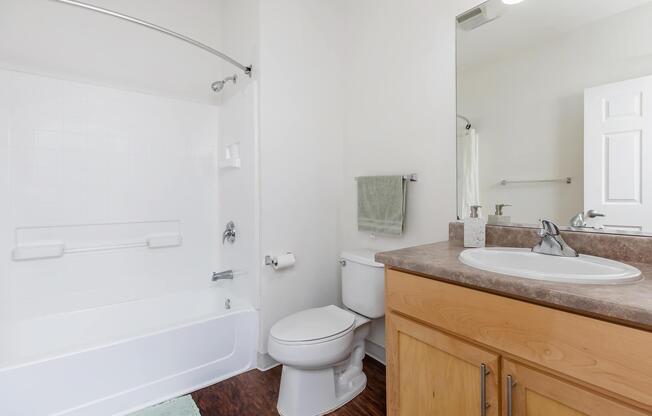 a room with a sink and a mirror
