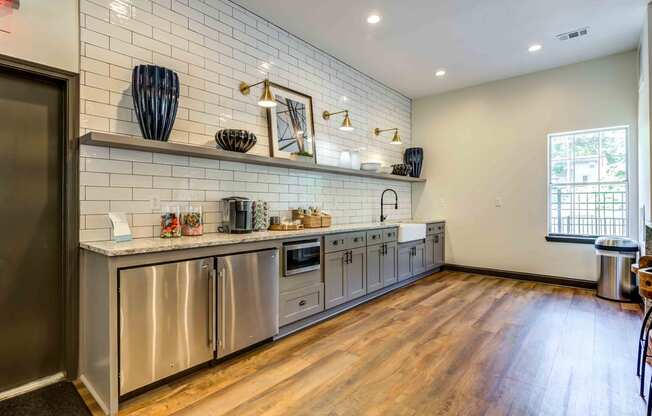 clubhouse kitchen with cabinets and shelves