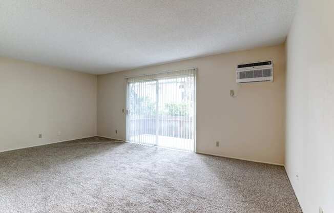 spacious room with sliding glass door