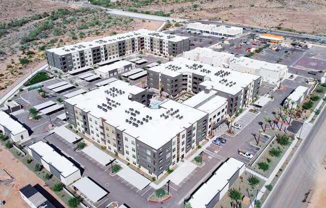 A large complex of buildings with parking lots in between.