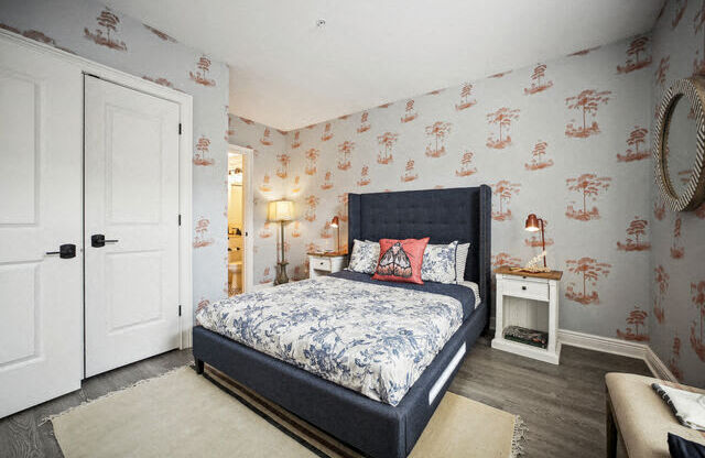 a bedroom with a bed and a white door