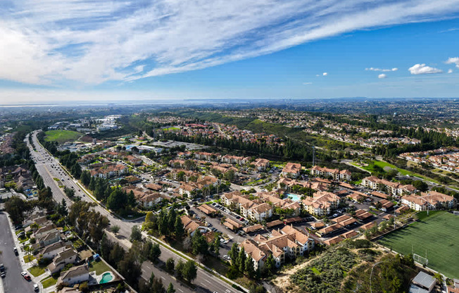 A suburban neighborhood with houses and a road.