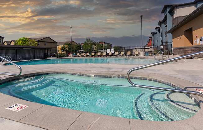 A swimming pool with a no swimming sign on the edge.