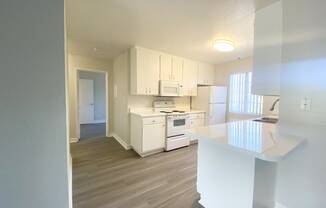 Kitchen with Island and view of hallway