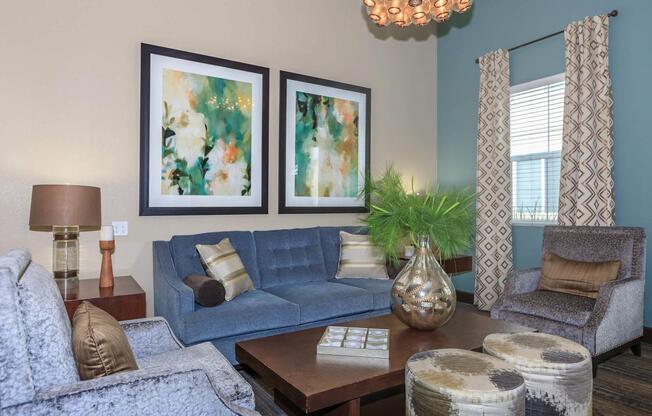 a living room filled with furniture and vase on a table