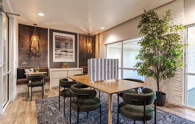 a dining room with a table and chairs