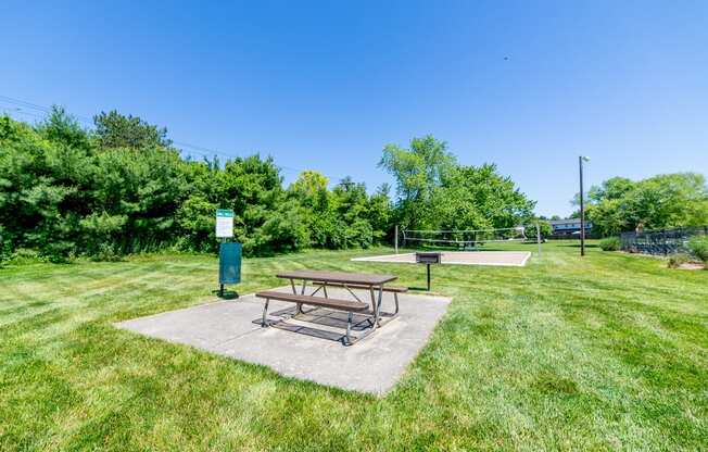 Picnic area with charcoal grill at Ashton Brook Apartments