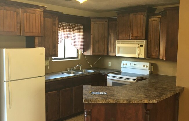 2 Bedroom 1.5  bath townhome with community pool!