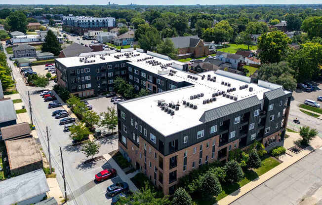 A large building with a parking lot in front of it.
