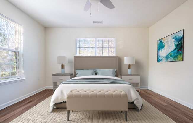 a bedroom with a bed and a ceiling fan