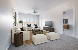 an open living room with white furniture and a ceiling fan