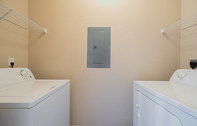 a washer and dryer in a laundry room with a door