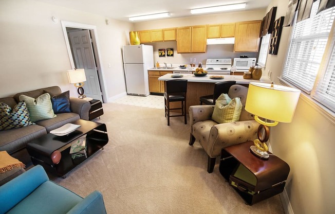 A well-lit, clean, and organized living space with a kitchen area.