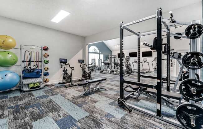 a glass display case filled with different types of shoes on display in a museum