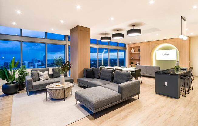 Expansive resident lounge at Modera Riverside with sweeping Miami views, ideal for relaxing or hosting with style.