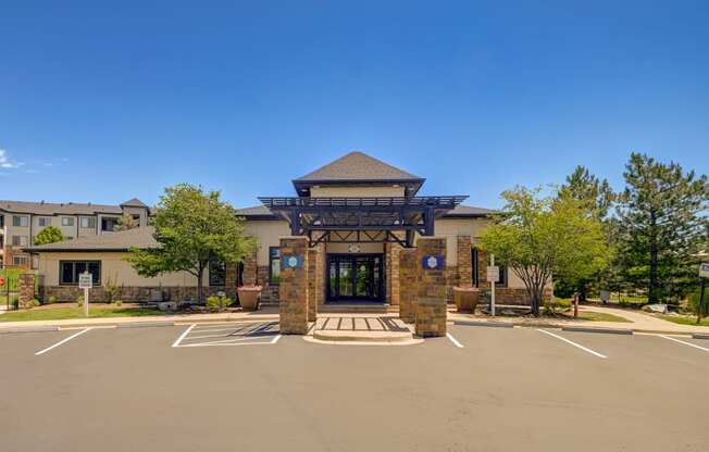 parking lot and building entrance at The Fletcher Southlands, Aurora, CO