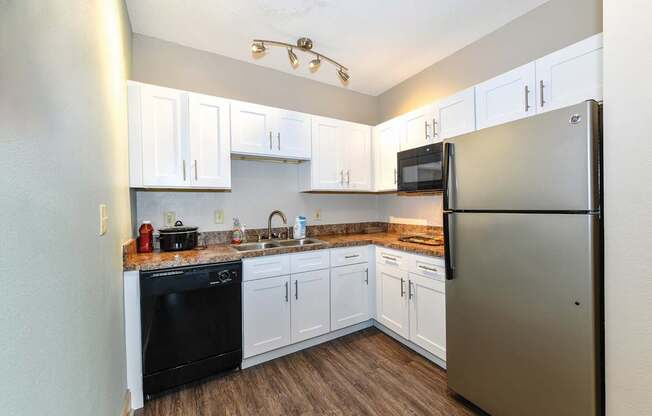 A kitchen with a black oven and a black microwave.at Park at Forest Hill, Memphis, 38125