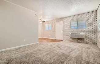 Living room with brick accent wall