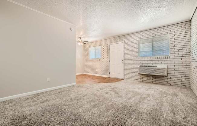 Living room with brick accent wall