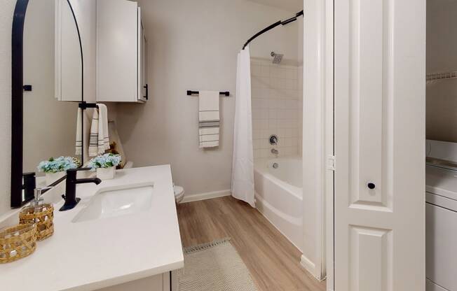 a bathroom with a bathtub and a sink