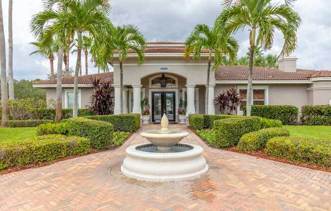 a house with a fountain in front of it at Heritage Bay, Florida