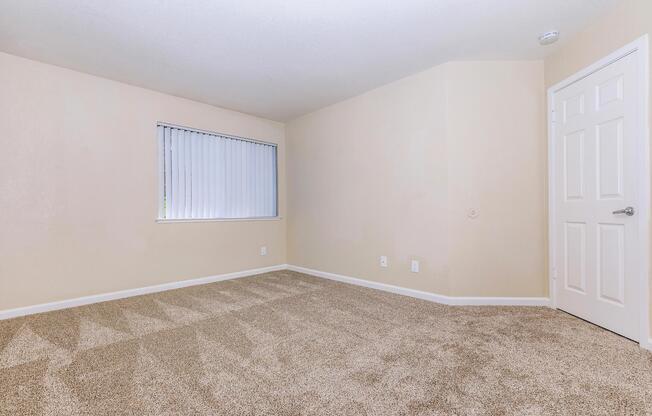 a bedroom with a large window