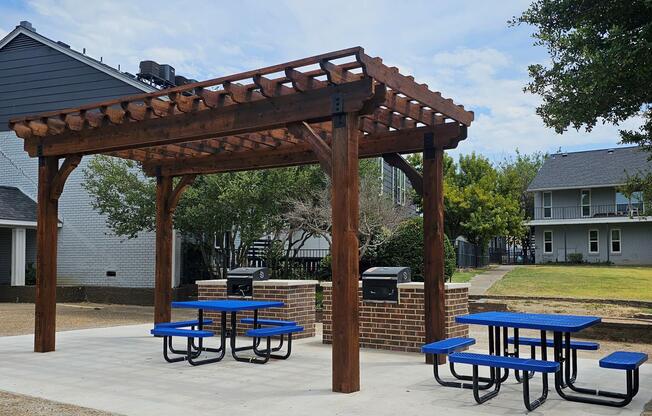 a wooden bench sitting on top of a picnic table