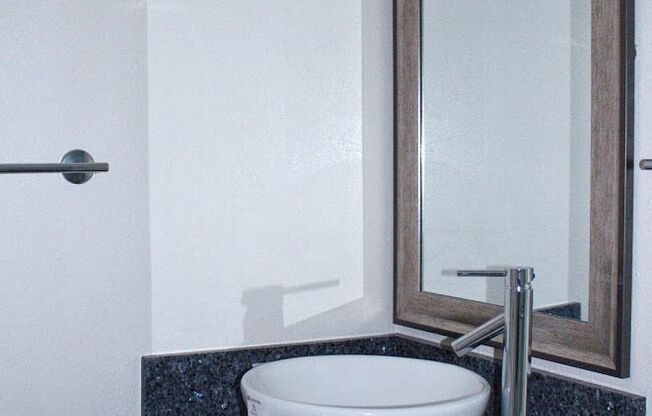 Napili Towers bathroom sink, mirror, and vanity