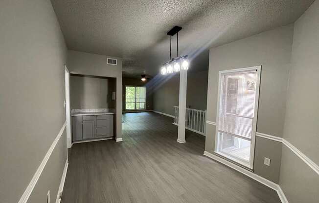 A room with a grey floor and white walls.