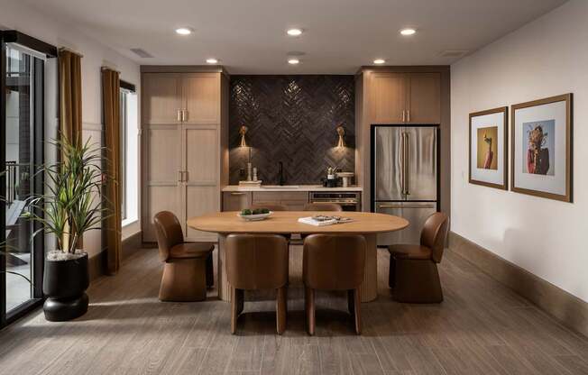 A modern dining room with a wooden table and chairs.