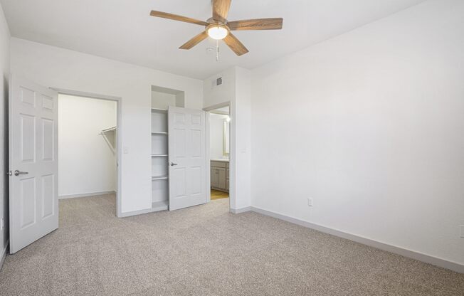an empty bedroom with a ceiling fan and a closet at The Legends at Eagle Mountain Lake, Fort Worth, TX