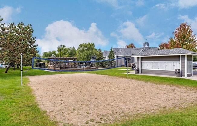 a house with a volleyball court in front of it
