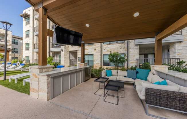 Lenox SoCo Apartments outdoor patio with tv