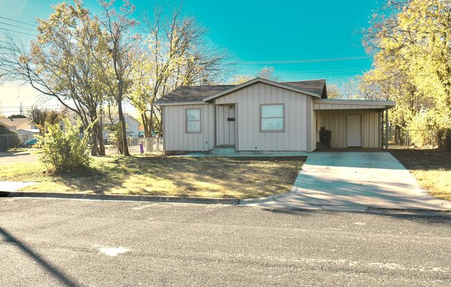 Charming 2 bedroom, 1 bath home with carport and spacious back yard!