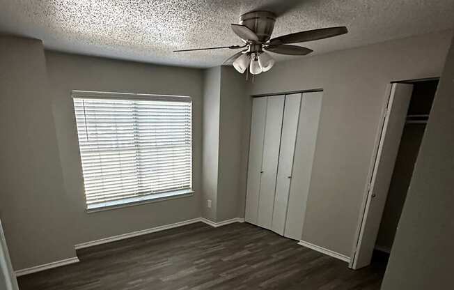 A ceiling fan hangs over a stairwell.
