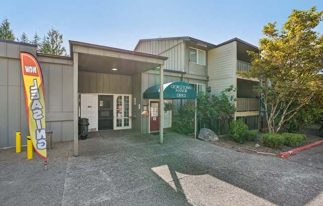 The entrance to a building with a sign that reads