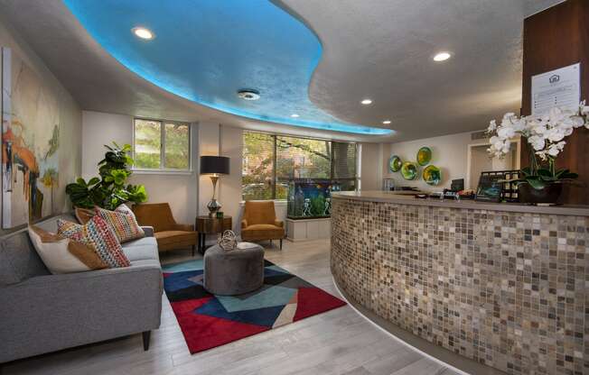 a lobby with a couch chairs and a coffee table