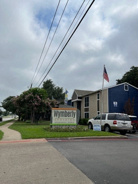 a wwpdt sign in front of a building