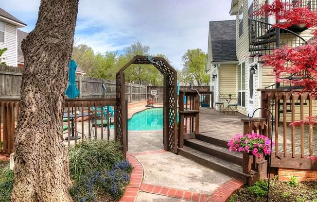 Executive Living in Norman complete with Safe room! Private pool with heater option and maintenance included! 1 bed guest house! 2 huge living areas, 2 dining areas, smart features and 2 cozy fireplaces!