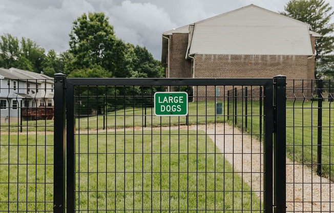 Dog park sign at Woodridge Apartments in Randallstown, MD 21133.